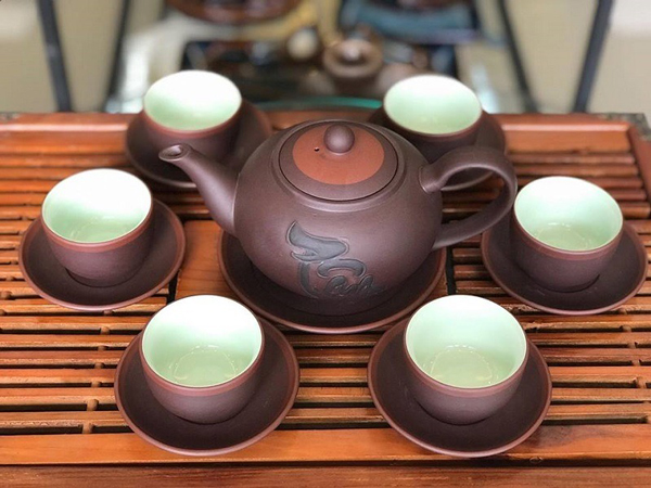 Tea set for many people enjoying tea together